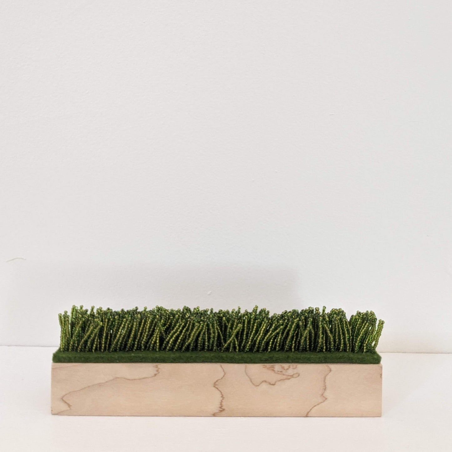 they built fields of grass on sawdust (maple)