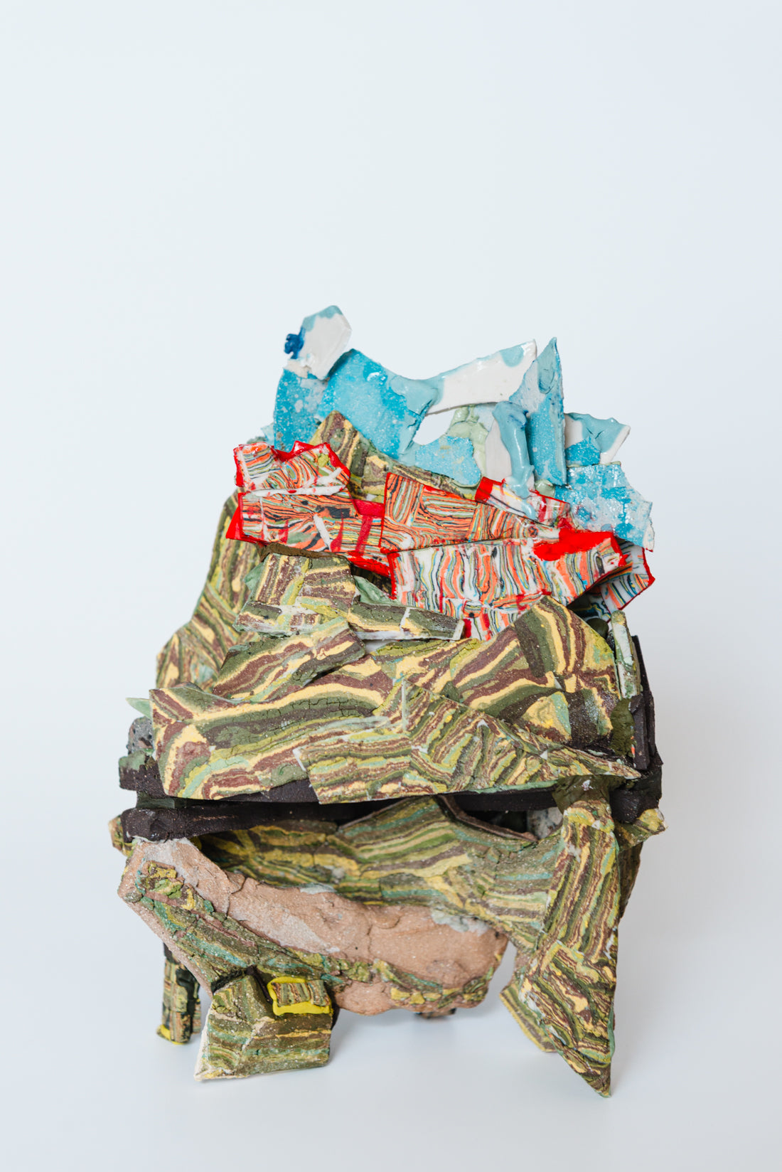 We climbed the moss and saw rusting metal, blood against grey sky. Occluded by green.