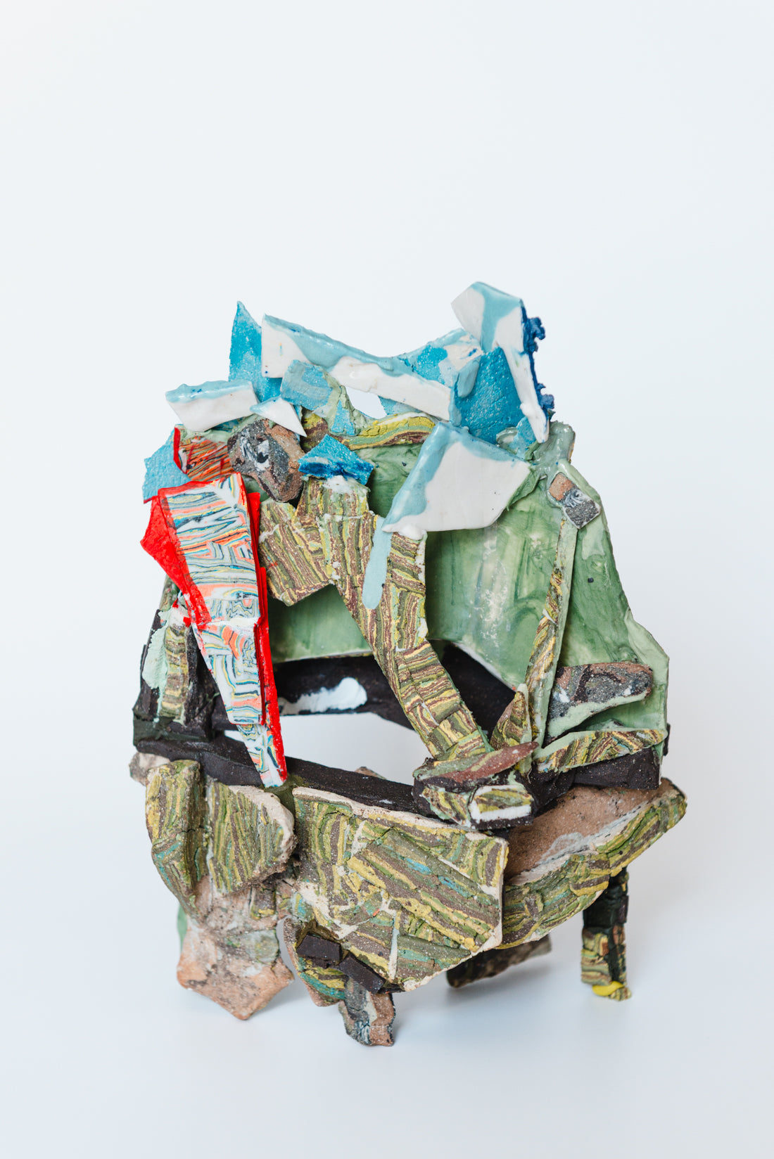 We climbed the moss and saw rusting metal, blood against grey sky. Occluded by green.